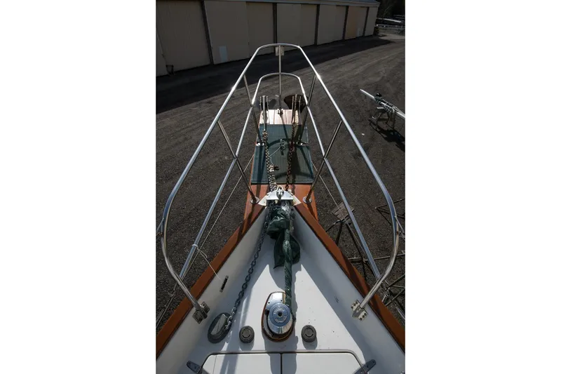 Slide: The Image of Bow view of 1999 Gozzard 37A sailboat with anchor and railing. - 8