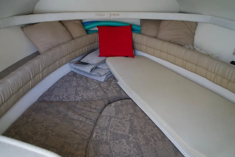 Slide: The Image of Cozy cabin interior of a 2000 Chris-Craft boat with cushions and bedding. - 10