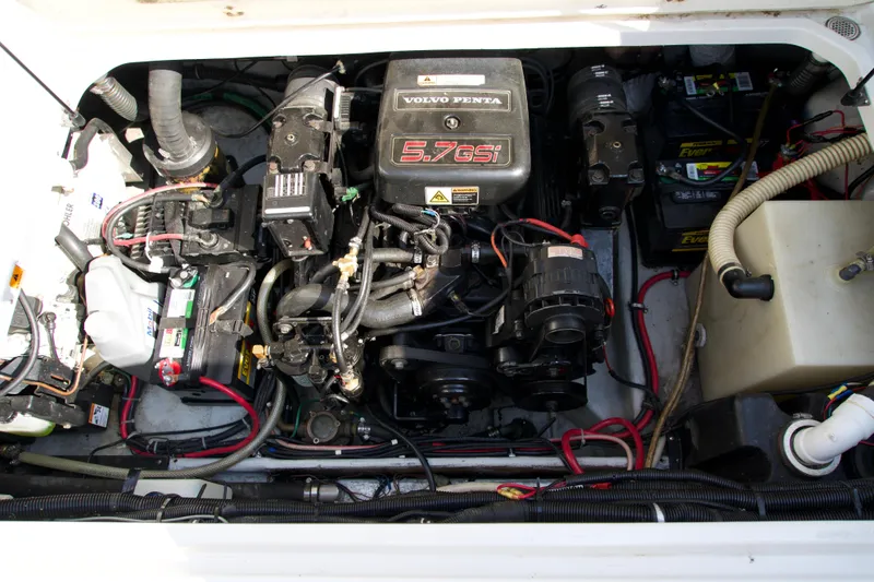 Slide: The Image of Engine compartment of a 2000 Chris-Craft boat featuring a Volvo Penta 5.7GSi engine. - 14