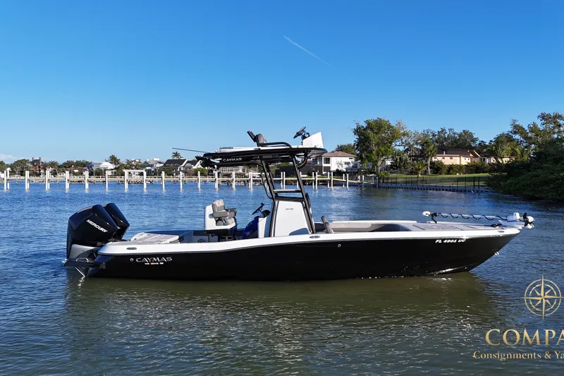The Image of 2025 Caymas 281 HB boat on calm water, featuring sleek design and powerful engines. - 0