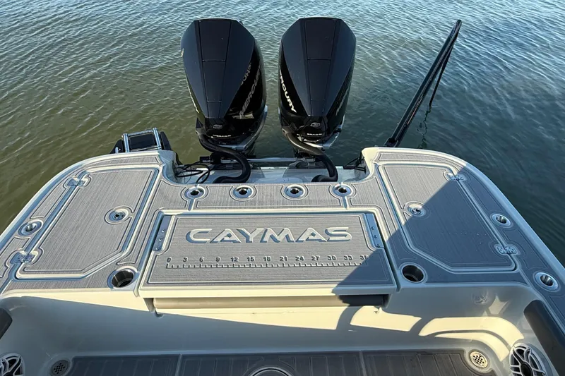 Slide: The Image of 2025 Caymas 281 HB boat with dual Mercury engines on water. - 19