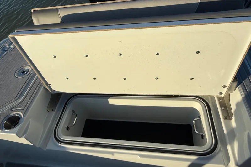 Slide: The Image of Open storage compartment on 2025 Caymas 281 HB boat, showcasing interior space. - 21
