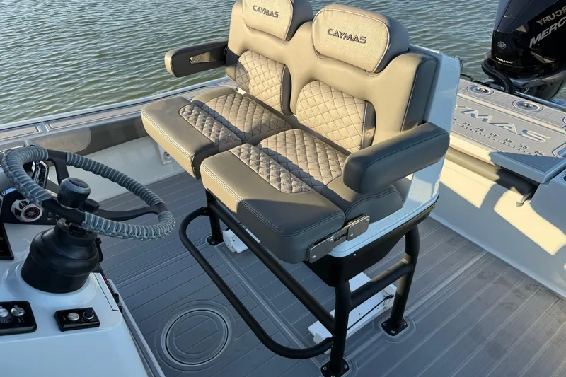 Slide: The Image of 2025 Caymas 281 HB boat interior with dual cushioned seats and steering wheel. - 31