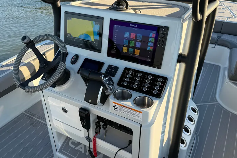 Slide: The Image of 2025 Caymas 281 HB boat dashboard with advanced navigation and control systems. - 34