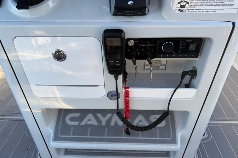 Slide: The Image of Control panel of 2025 Caymas 281 HB boat with radio and storage compartment. - 36