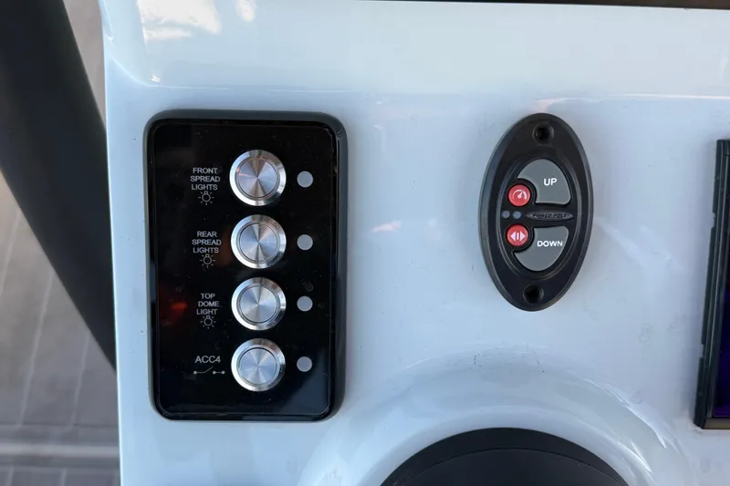 Slide: The Image of Control panel of 2025 Caymas 281 HB boat with light and power switches. - 37