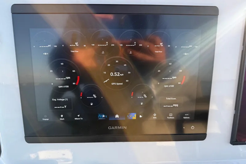 Slide: The Image of Garmin display on 2025 Caymas 281 HB boat showing engine metrics and GPS speed. - 39