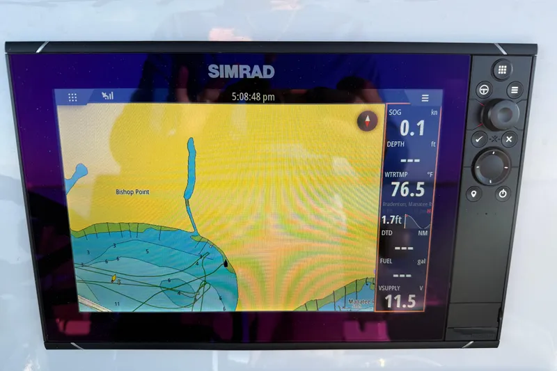 Slide: The Image of Simrad navigation display on 2025 Caymas 281 HB boat, showing map and data. - 42