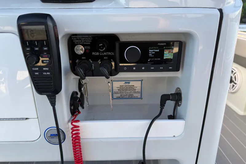 Slide: The Image of Control panel of 2025 Caymas 281 HB boat with radio and communication equipment. - 44