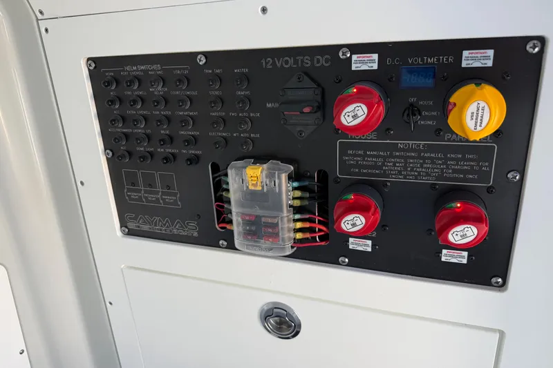 Slide: The Image of Control panel of 2025 Caymas 281 HB boat with switches and voltmeter. - 49