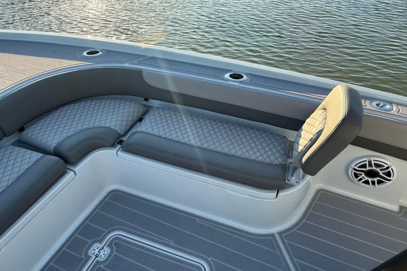 Slide: The Image of Luxurious seating on 2025 Caymas 281 HB boat, featuring quilted upholstery and sleek design. - 52