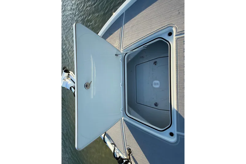 Slide: The Image of Open storage compartment on 2025 Caymas 281 HB boat deck. - 55