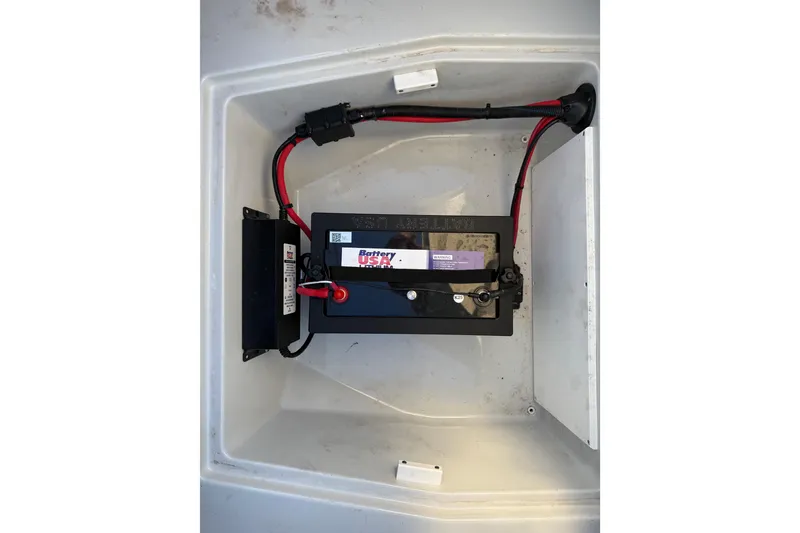 Slide: The Image of Battery compartment of 2025 Caymas 281 HB boat with wiring connections. - 56