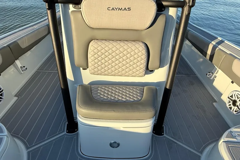 Slide: The Image of 2025 Caymas 281 HB boat interior with cushioned seating and sleek design. - 59