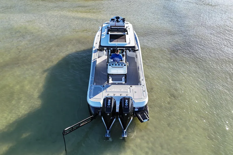Slide: The Image of 2025 Caymas 281 HB boat on clear shallow water, aerial view. - 6