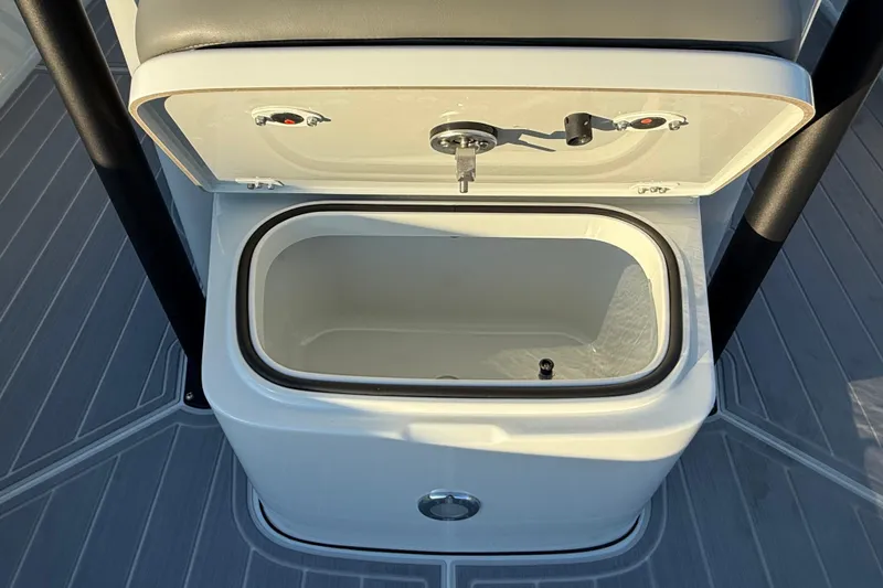 Slide: The Image of Open storage compartment on 2025 Caymas 281 HB boat, featuring sleek design and durable materials. - 60