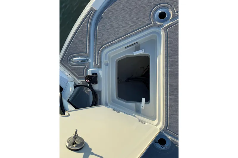 Slide: The Image of 2025 Caymas 281 HB boat deck with open storage compartment. - 61