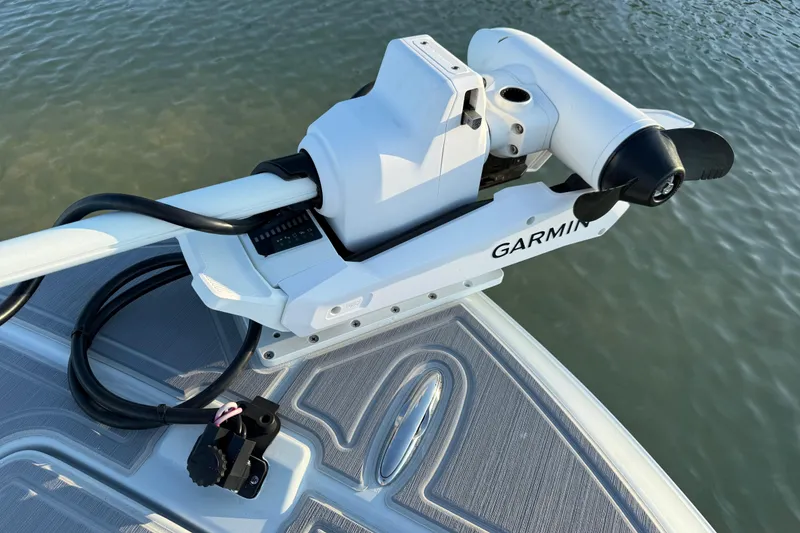 Slide: The Image of Garmin trolling motor on 2025 Caymas 281 HB boat, docked on water. - 62