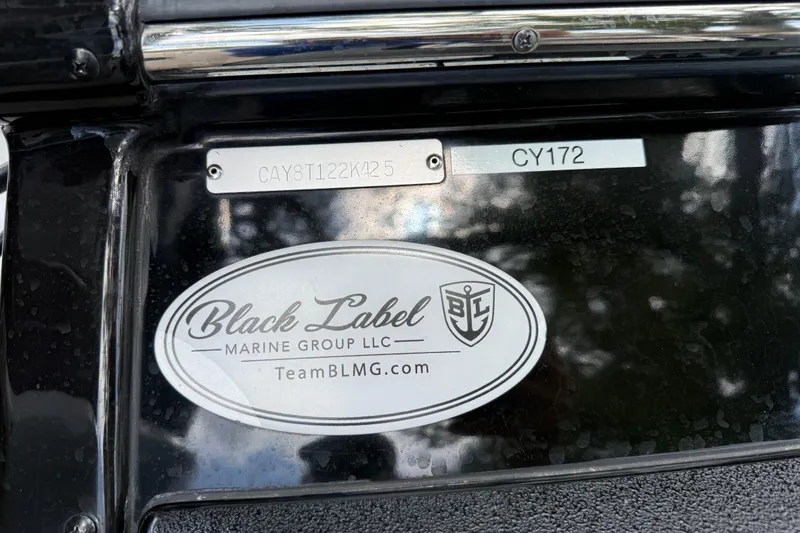 Slide: The Image of Black Label Marine Group logo on 2025 Caymas 281 HB boat. - 64