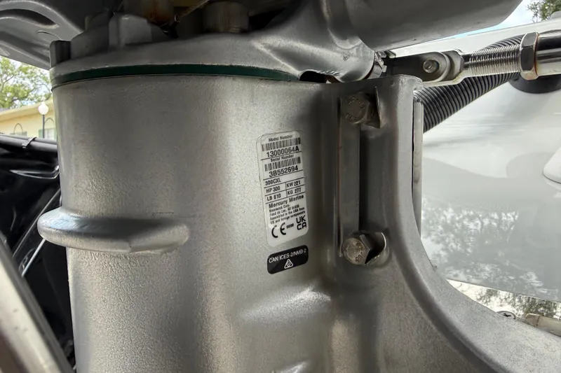 Slide: The Image of Close-up of a 2025 Caymas 281 HB boat engine component with label details. - 65