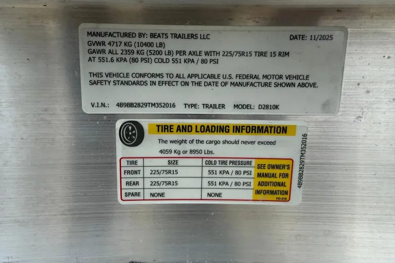 Slide: The Image of 2025 Caymas 281 HB trailer specifications label with tire and loading information. - 67