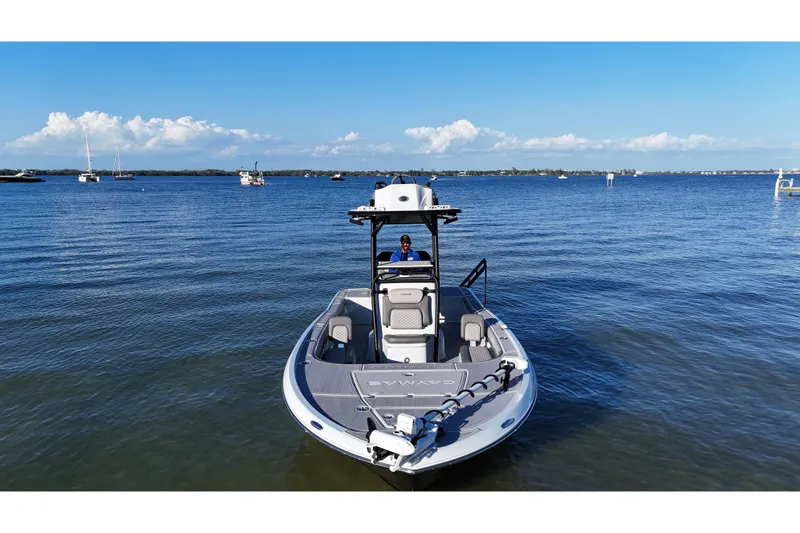 Slide: The Image of 2025 Caymas 281 HB boat on calm water, clear sky, and distant boats. - 8