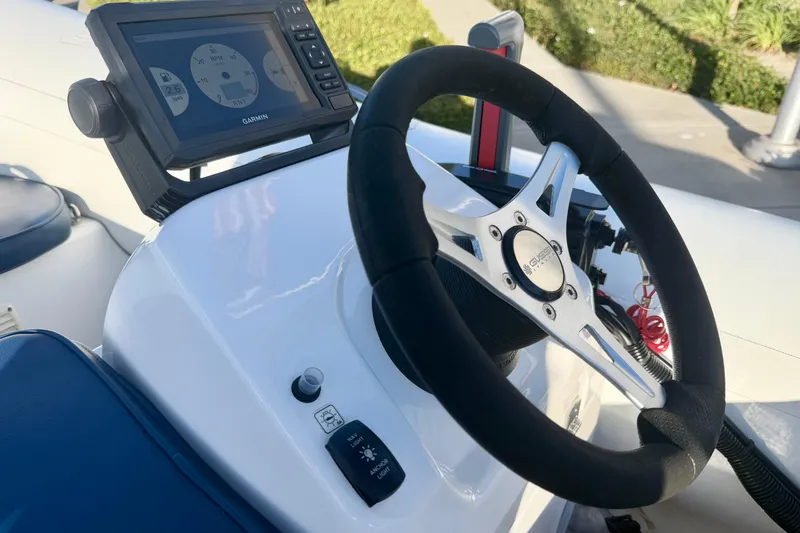 Slide: The Image of Steering console of 2018 Brig Falcon 360 boat with Garmin navigation system. - 10