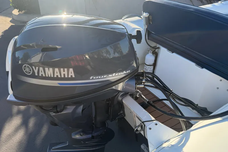 Slide: The Image of 2018 Brig Falcon 360 with Yamaha four-stroke outboard motor, docked in sunlight. - 16