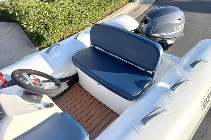 Slide: The Image of 2018 Brig Falcon 360 inflatable boat with Yamaha outboard motor and blue seating. - 3