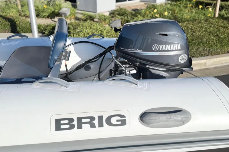 Slide: The Image of 2018 Brig Falcon 360 inflatable boat with Yamaha outboard motor, parked outdoors. - 7