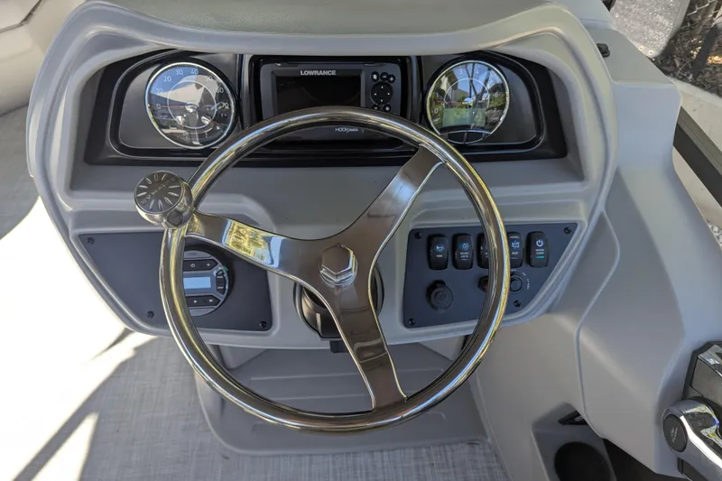 Slide: The Image of Steering console of 2026 Dockside 22DQ2.75 boat with gauges and controls. - 3