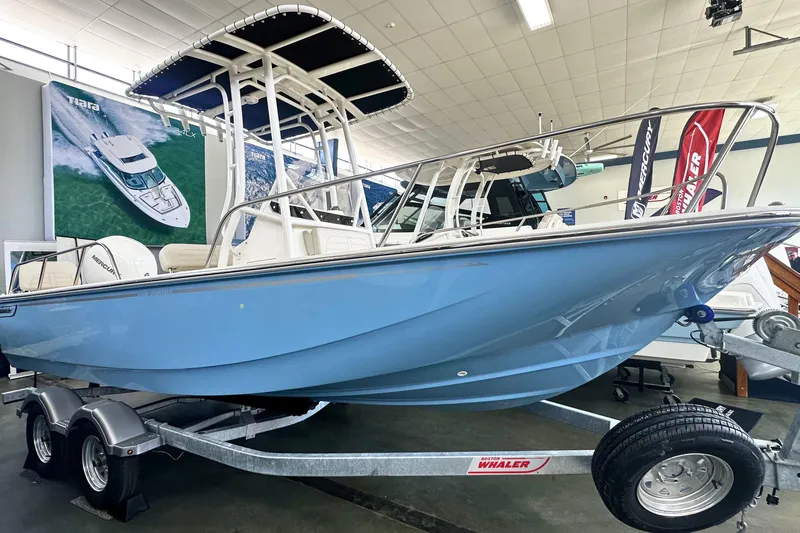 The Image of 2026 Boston Whaler 190 Montauk boat displayed in showroom on trailer. - 0