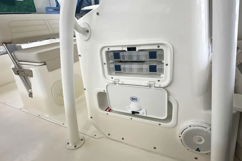 Slide: The Image of 2026 Boston Whaler 190 Montauk interior with storage compartments and seating. - 16