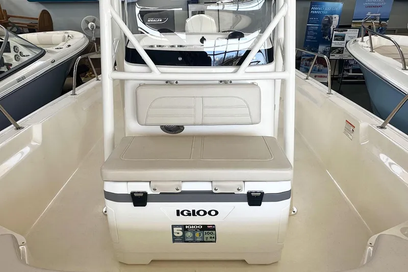 Slide: The Image of 2026 Boston Whaler 190 Montauk boat interior with Igloo cooler and seating. - 18