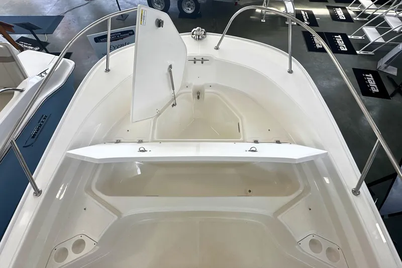 Slide: The Image of 2026 Boston Whaler 190 Montauk boat interior with open storage compartments. - 20