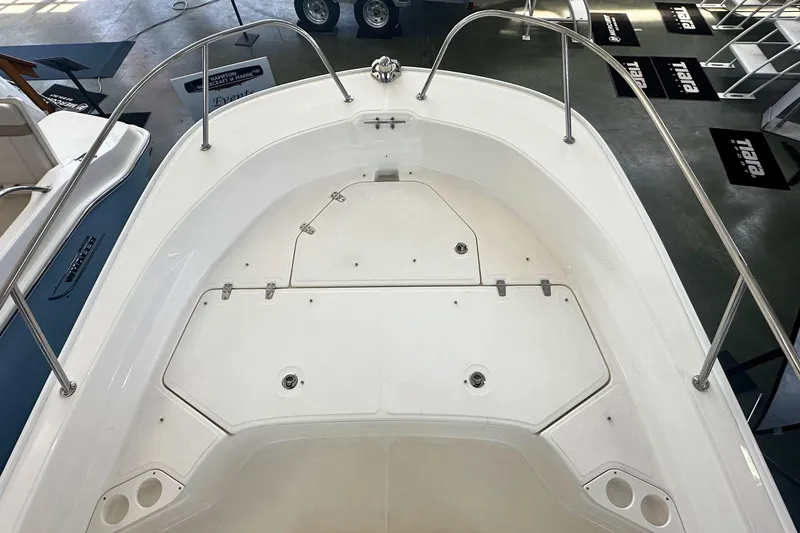 Slide: The Image of 2026 Boston Whaler 190 Montauk boat deck with storage compartments and stainless steel railings. - 21