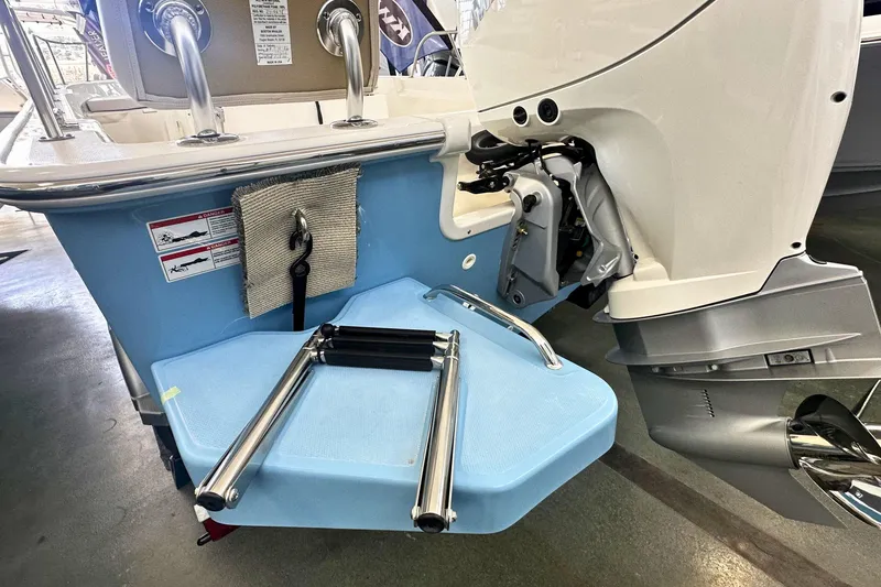 Slide: The Image of 2026 Boston Whaler 190 Montauk boat with motor and swim ladder detail. - 4