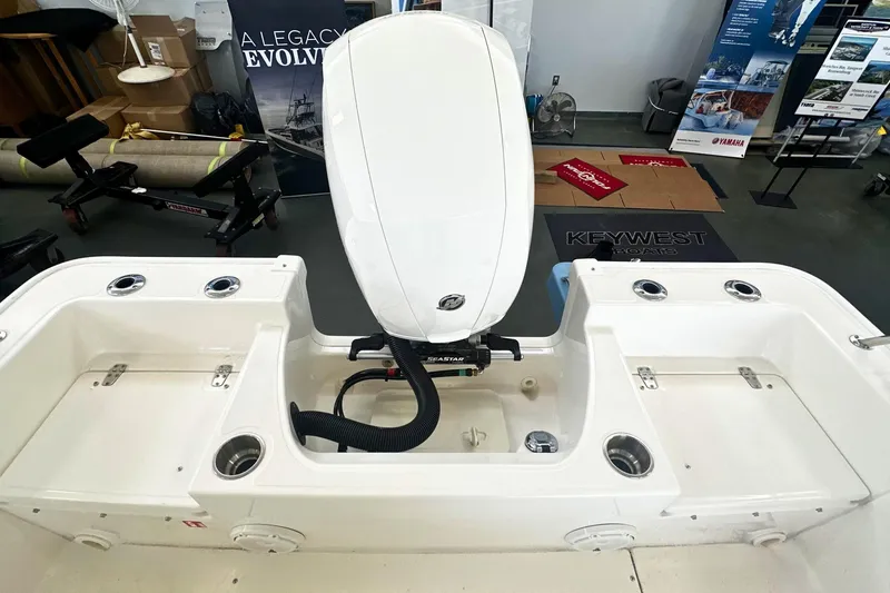 Slide: The Image of 2026 Boston Whaler 190 Montauk boat interior with engine and storage compartments. - 5