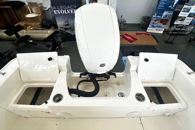 Slide: The Image of 2026 Boston Whaler 190 Montauk boat interior with engine and storage compartments. - 7
