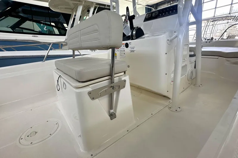Slide: The Image of 2026 Boston Whaler 190 Montauk boat interior with seating and console. - 9