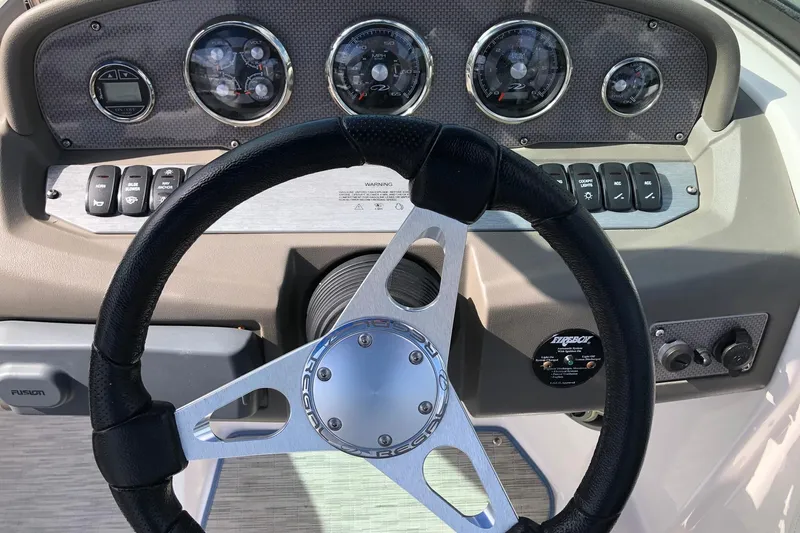 Slide: The Image of Steering wheel and dashboard of 2015 Regal 2000 ESX Bowrider boat. - 12