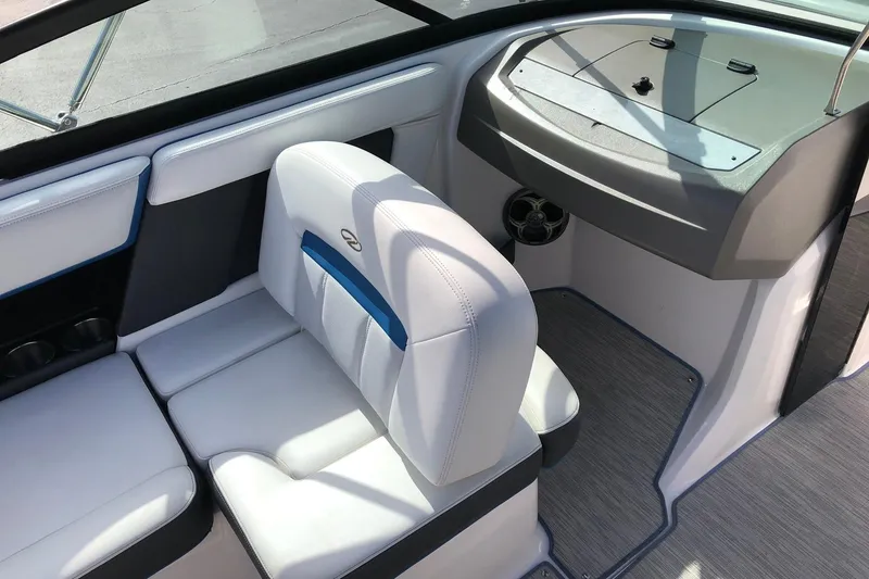 Slide: The Image of Interior of a 2015 Regal 2000 ESX Bowrider with white seating and modern dashboard. - 13