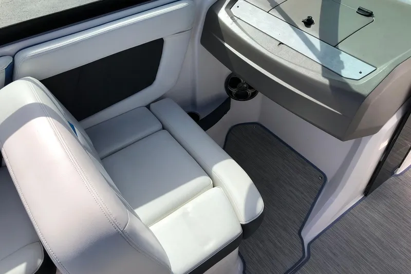 Slide: The Image of Interior of 2015 Regal 2000 ESX Bowrider with white seating and dashboard. - 14