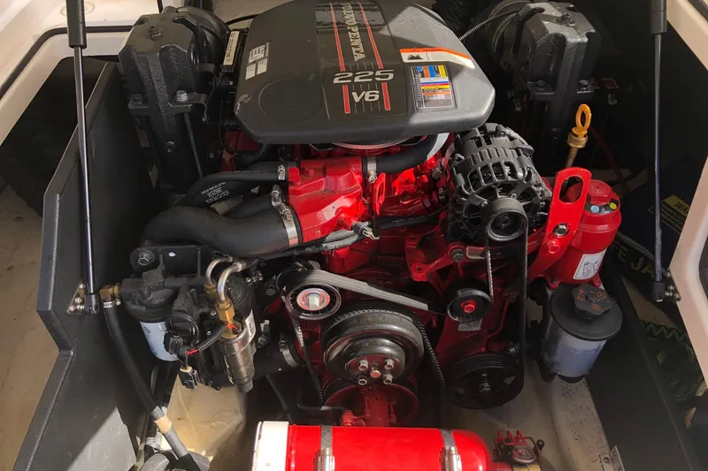 Slide: The Image of Engine compartment of a 2015 Regal 2000 ESX Bowrider, featuring a 225 V6 engine. - 19
