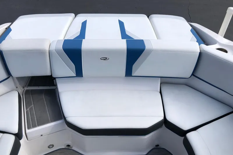 Slide: The Image of 2015 Regal 2000 ESX Bowrider boat interior with white and blue seating. - 20