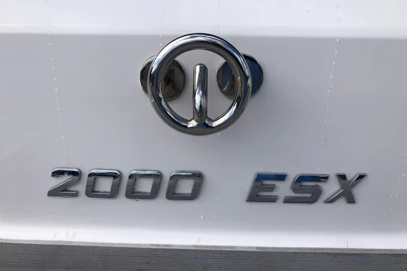Slide: The Image of 2015 Regal 2000 ESX Bowrider emblem on white surface. - 24