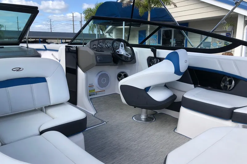 Slide: The Image of Interior of a 2015 Regal 2000 ESX Bowrider with white and blue seating. - 8