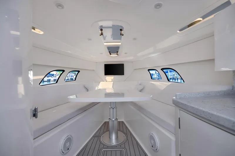 Slide: The Image of Interior of 2016 Intrepid 400 Cuddy boat with modern seating and windows. - 19
