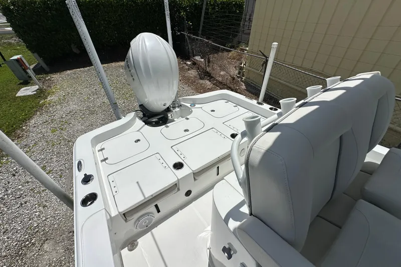 Slide: The Image of 2023 Sea Hunt BX 25 BR boat with outboard motor and seating area. - 10
