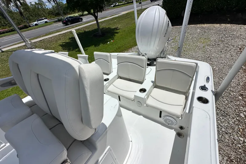 Slide: The Image of 2023 Sea Hunt BX 25 BR boat with white seating and Yamaha outboard motor. - 11